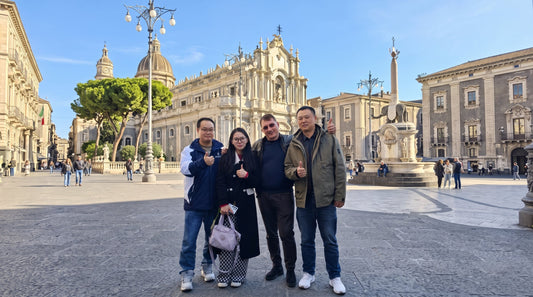 INDIGO team exploring a historic city square in Italy during the 2024 exhibition trip