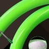Bright green flexible Cyclami MTB mountain bike inner tube on dark background, bendable anti-burst bicycle replacement tube, circular close-up inset of virgin transparent rubber pellet raw material, heavy duty puncture resistant bike inner tube