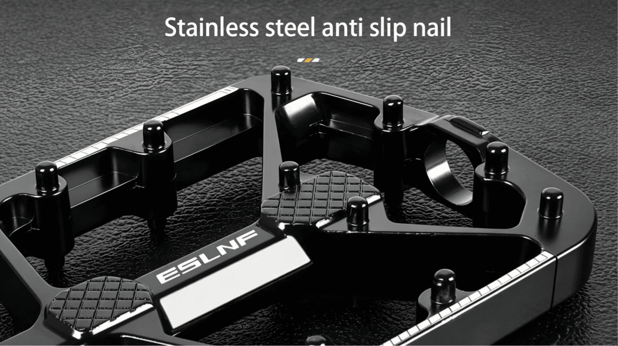 Close-up shot of black aluminum bicycle pedal stainless steel anti slip nails, textured dark leather background, ESLNF brand logo on pedal